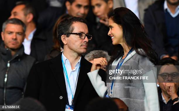 French President Jacques-Henri Eyraud speaks with Monica, wife of the Olympique de Marseille's new owner Frank McCourt during the French L1 football...