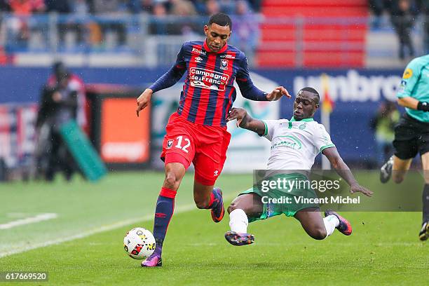 Ronny Rodelin of Caen and Henri Saivet of Saint-Etienne during the Ligue 1 match between SM Caen and AS Saint-Etienne at Stade Michel D'Ornano on...