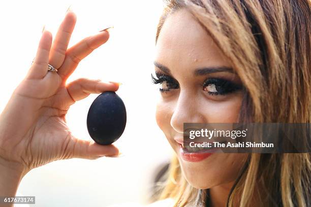 Contestants of Miss International Beauty Pageant 2016 poses with 'Kuro Tamago' cooked in Owakudani's hot spring on October 24, 2016 in Hakone,...