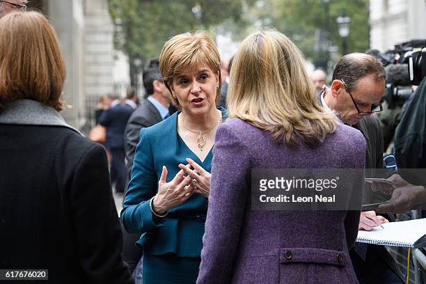Scottish First Minister Nicola Sturgeon speaks to journalists after a meeting between British Prime Minister Theresa May and the leaders of the three...