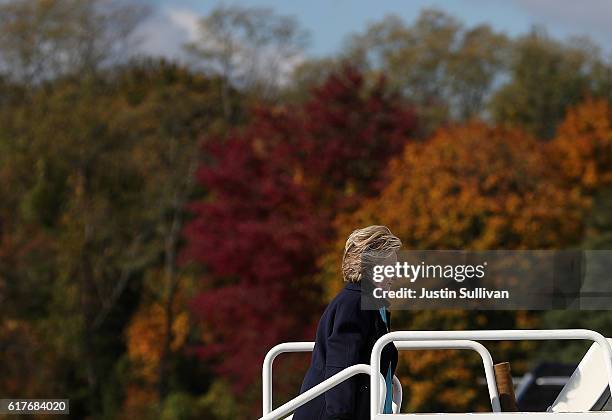 Democratic presidential nominee former Secretary of State Hillary Clinton boards her campaign plane at Westchester County Airport on October 24, 2016...