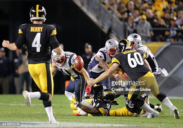 New England Patriots player Julian Edelman fumbles a punt by punter Jordan Berry during the fourth quarter. The New England Patriots take on the...