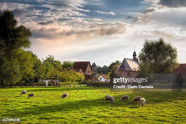 scenic village - church sunset rural scene stock pictures, royalty-free photos & images