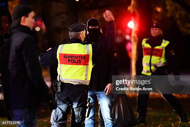 Police looks on as fans approaches the arena ahead of the Allsvenskan match between IFK Goteborg and AIK at Gamla Ullevi on October 24, 2016 in...