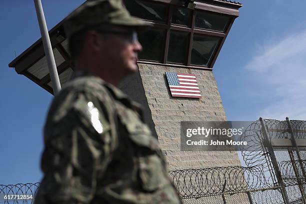 Naval officer stands at the entrance of the U.S. Prison at Guantanamo Bay, also known as "Gitmo" on October 22, 2016 at the U.S. Naval Station at...