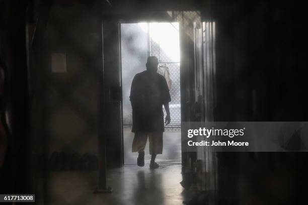 Prisoner walks to an outdoor area of the "Gitmo" maximum security detention center on October 22, 2016 at the U.S. Naval Station at Guantanamo Bay,...