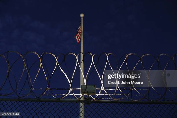 Razor wire lines the fence of the "Gitmo" detention center on October 22, 2016 at the U.S. Naval Station at Guantanamo Bay, Cuba. The U.S. Military's...