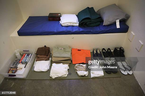 Permitted items for prisoners sit out on display during a media tour of the "Gitmo" maximum security detention center on October 22, 2016 at the U.S....