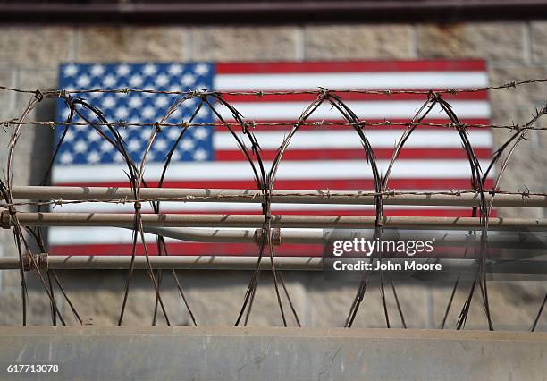 Razor wire lines the fence of the "Gitmo" maximum security detention center on October 22, 2016 at the U.S. Naval Station at Guantanamo Bay, Cuba....