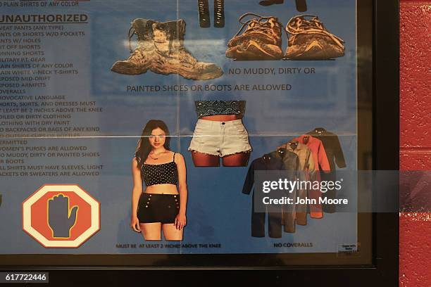 Personal dress guideline for military personel hangs at the entrance of a dining hall near the prison at Guantanamo Bay, also known as "Gitmo" on...