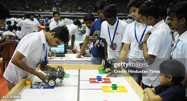 Students making robots during World Robot Olympiad which is being held for the first time in Kolkata on October 23, 2016 in Kolkata, India.