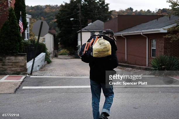 Harold, who is homeless, walks downtown on October 24, 2016 in East Liverpool, Ohio. East Liverpool, once prosperous from steel mills and a vibrant...