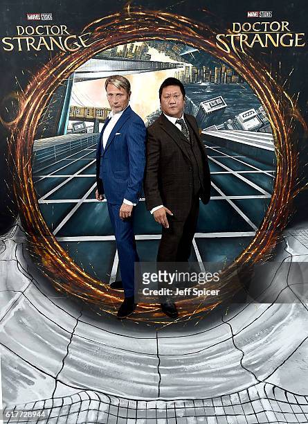 Mads Mikkelsen and Benedict Wong in front of the Doctor Strange inspired 3D Art at a fan screening, to celebrate the release of Marvel Studio's...