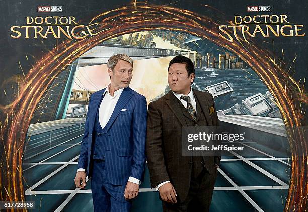 Mads Mikkelsen and Benedict Wong in front of the Doctor Strange inspired 3D Art at a fan screening, to celebrate the release of Marvel Studio's...