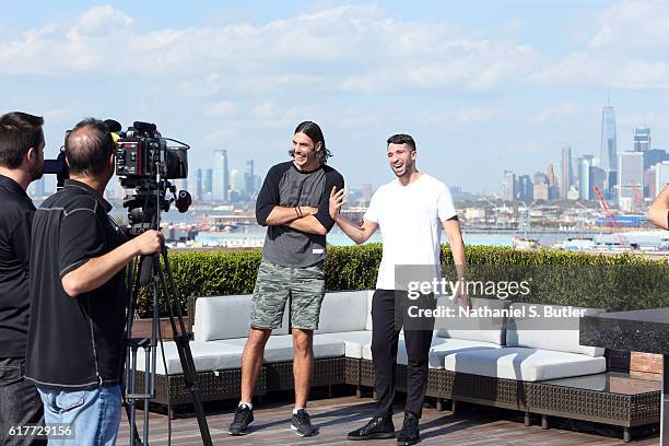 Luis Scola and Greivis Vasquez of the Brooklyn Nets talk to NBAE during an interview after practice at HSS Training Center on October 19, 2016 in...