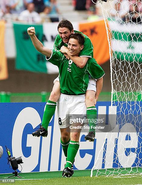 Matt Holland of Ireland celebrates with team mate Robbie Keane after scoring the equalising goal during the 2002 FIFA World Cup - First Round, Group...