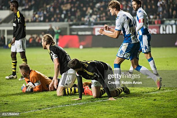 Nils-Eric Johansson and Sauli Vaisanen of AIK dejected after John Alvbage, goalkeeper of IFK Goteborg saves the last chance in the match and Thomas...