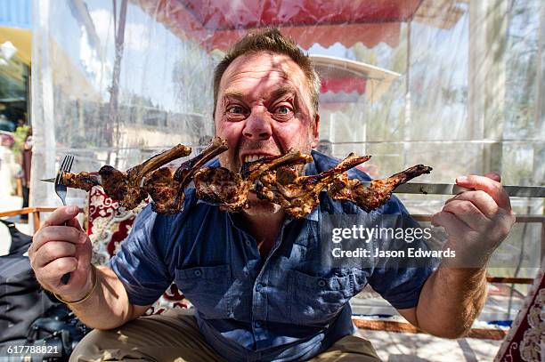 Man Eating Ribs Photos and Premium High Res Pictures - Getty Images
