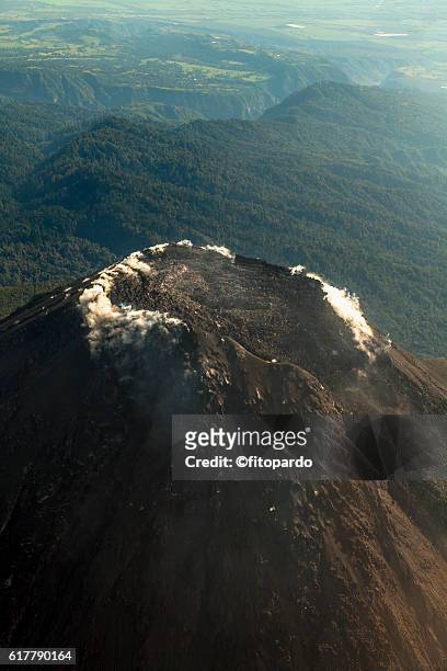 volcán de colima eruptions from a plane - volcán stock pictures, royalty-free photos & images