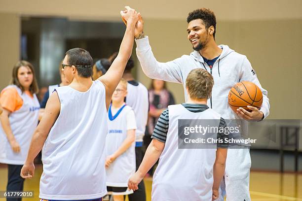 Michael Gbinije of the Detroit Pistons participates in the Jr. Pistons clinic with the youth from the Special Olympics Michigan on October 20, 2016...