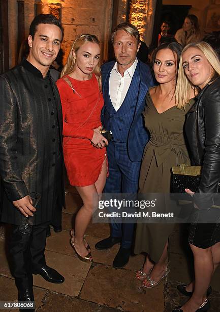 Alaa Safi, Katrina Durden, Mads Mikkelsen, Zara Phythian and guest attend Marvel Studios and British GQ hosted reception in The Cloisters at...