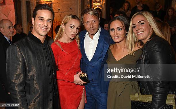 Alaa Safi, Katrina Durden, Mads Mikkelsen, Zara Phythian and guest attend Marvel Studios and British GQ hosted reception in The Cloisters at...