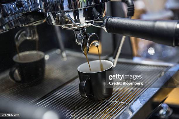 Coffee pours from an espresso machine into a cup at a Starbucks Corp. Coffee shop in Phnom Penh, Cambodia on Monday, Oct. 24, 2016. The Seattle-based...