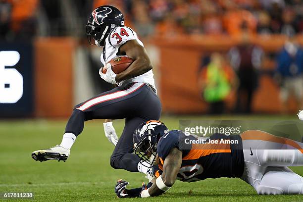 Tyler Ervin of the Houston Texans escapes the grasp of Zaire Anderson of the Denver Broncos during the first quarter on Monday, October 24, 2016. The...