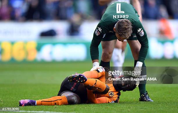 Nouha Dicko of Wolverhampton Wanderers is checked on by Robert Green of Leeds United during the Sky Bet Championship match between Wolverhampton...
