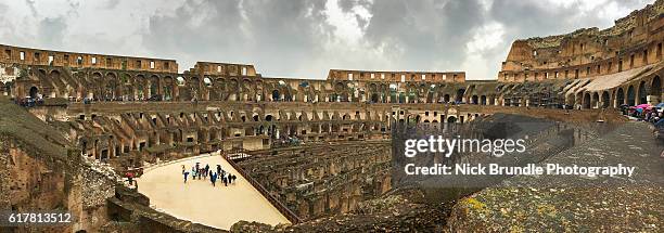 panorama of the inside of the colosseum, rome, italy. - colosseum sunset foto e immagini stock