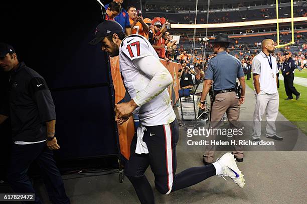 Brock Osweiler of the Houston Texans runs into the locker room after the fourth quarter of the Denver Broncos' 27-9 win on Monday, October 24, 2016....