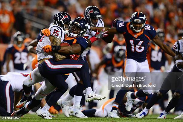 Wide receiver Will Fuller of the Houston Texans is tackled by outside linebacker Corey Nelson of the Denver Broncos on a kickoff return in the second...