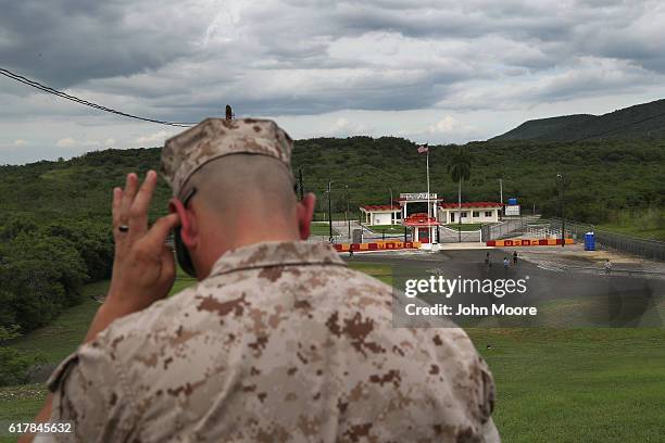 Marine stands overlooking the Northeast Gate, the only entrance from the U.S. Naval Station at Guantanamo into the rest of Cuba on October 23, 2016...