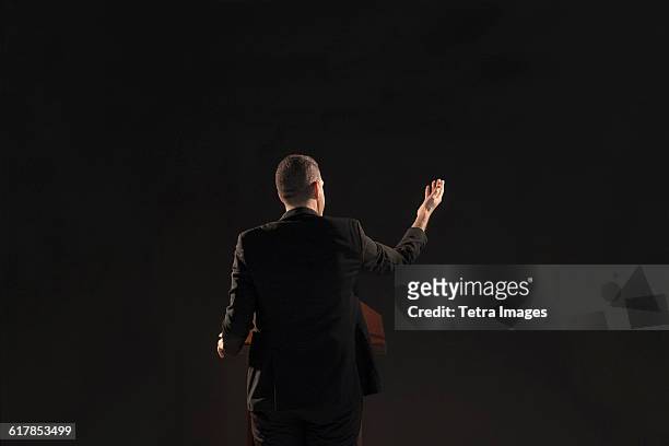 politician giving speech - politician back stock pictures, royalty-free photos & images