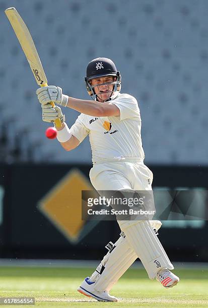 Marcus Harris of Victoria hits a boundary as he bats during day one of the Sheffield Shield match between Victoria and Tasmania at the Melbourne...