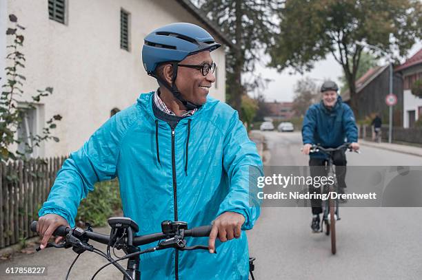 "male friends cycling on road, bavaria, germany" - bike handle stock pictures, royalty-free photos & images