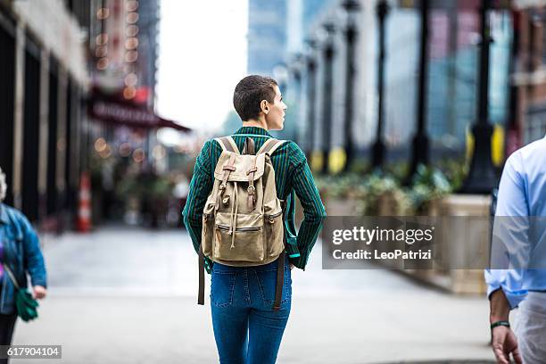 young woman walking for shopping in downtown chicago - chicago sweets stock pictures, royalty-free photos & images