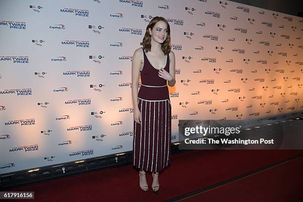 Emma Stone poses on the red carpet at the 19th annual the Kennedy Center's Mark Twain prize for American humor awarded this year to Bill Murray...
