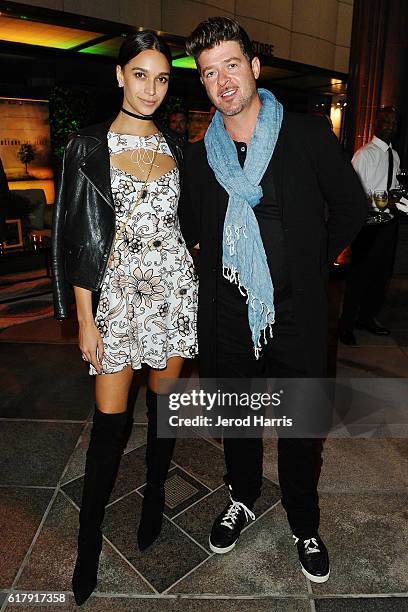 April Love Geary and Robin Thicke arrive at the National Geographic 'Before The Flood' Screening at Bing Theatre At LACMA on October 24, 2016 in Los...