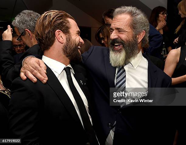 Director Mel Gibson and his son actor Milo Gibson pose at the after party for a screening of Summit Entertainment's "Hacksaw Ridge" at the Academy of...