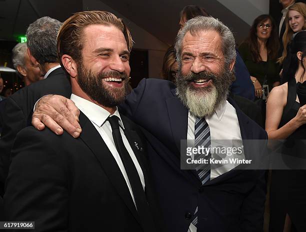 Director Mel Gibson and his son actor Milo Gibson pose at the after party for a screening of Summit Entertainment's "Hacksaw Ridge" at the Academy of...