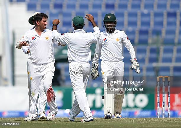 Yasir Shah of Pakistan celebrates with the team taking the wicket of Jason Holder of West Indies during Day Five of the Second Test between Pakistan...