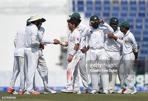 Yasir Shah of Pakistan celebrates with the team taking the wicket of Jason Holder of West Indies during Day Five of the Second Test between Pakistan...