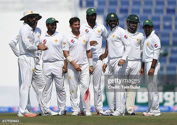 Yasir Shah of Pakistan celebrates with the team taking the wicket of Jason Holder of West Indies during Day Five of the Second Test between Pakistan...