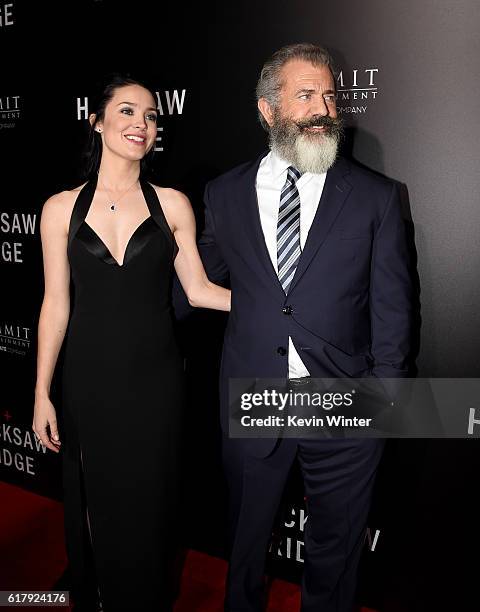 Rosalind Ross and director Mel Gibson arrive at the screening of Summit Entertainment's "Hacksaw Ridge" at the Samuel Goldwyn Theater on October 24,...