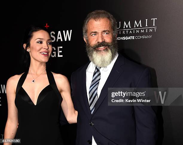 Rosalind Ross and director Mel Gibson arrive at the screening of Summit Entertainment's "Hacksaw Ridge" at the Samuel Goldwyn Theater on October 24,...