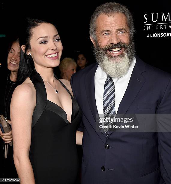 Rosalind Ross and director Mel Gibson arrive at the screening of Summit Entertainment's "Hacksaw Ridge" at the Samuel Goldwyn Theater on October 24,...