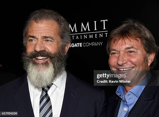 Director Mel Gibson and Patrick Wachsberger, co-chairman, Lions Gate Motion Picture Group arrive at the screening of Summit Entertainment's "Hacksaw...