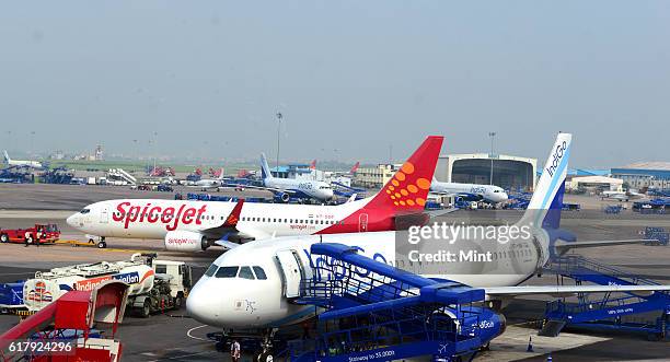 The picture featuring Planes of various airlines parked at the IGI airport on July 25, 2013 in New Delhi, India.