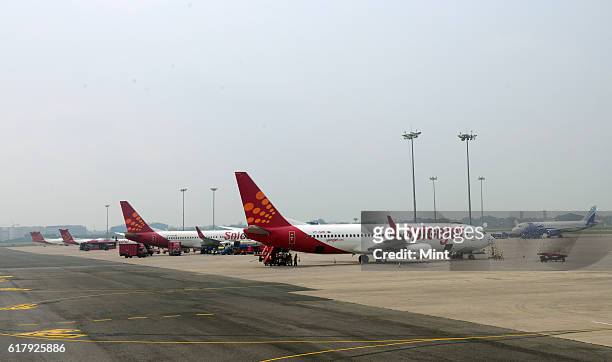 The picture featuring Planes of various airlines parked at the IGI airport on July 25, 2013 in New Delhi, India.